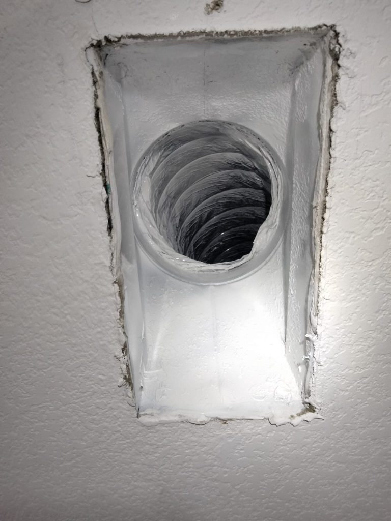 Ceiling vent opening connected to newly installed air duct system.