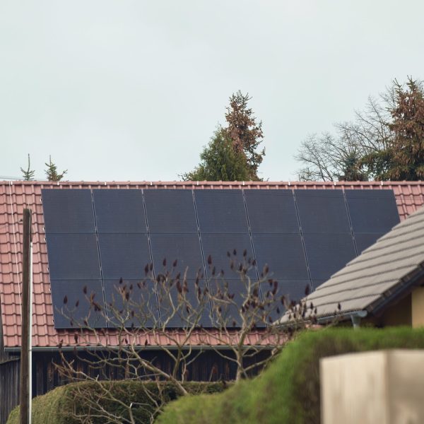 Concept of sustainable future. Solar roof installation company. Solar Panels and Photovoltaic.