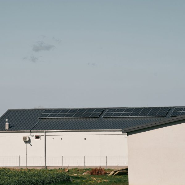 Concept of sustainable future. Solar roof installation company. Solar Panels and Photovoltaic.